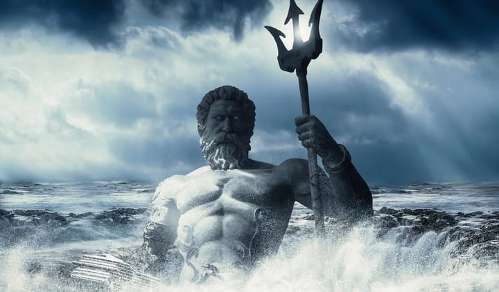 Sculpture of greek god poseidon in the backdrop of a stormy sea